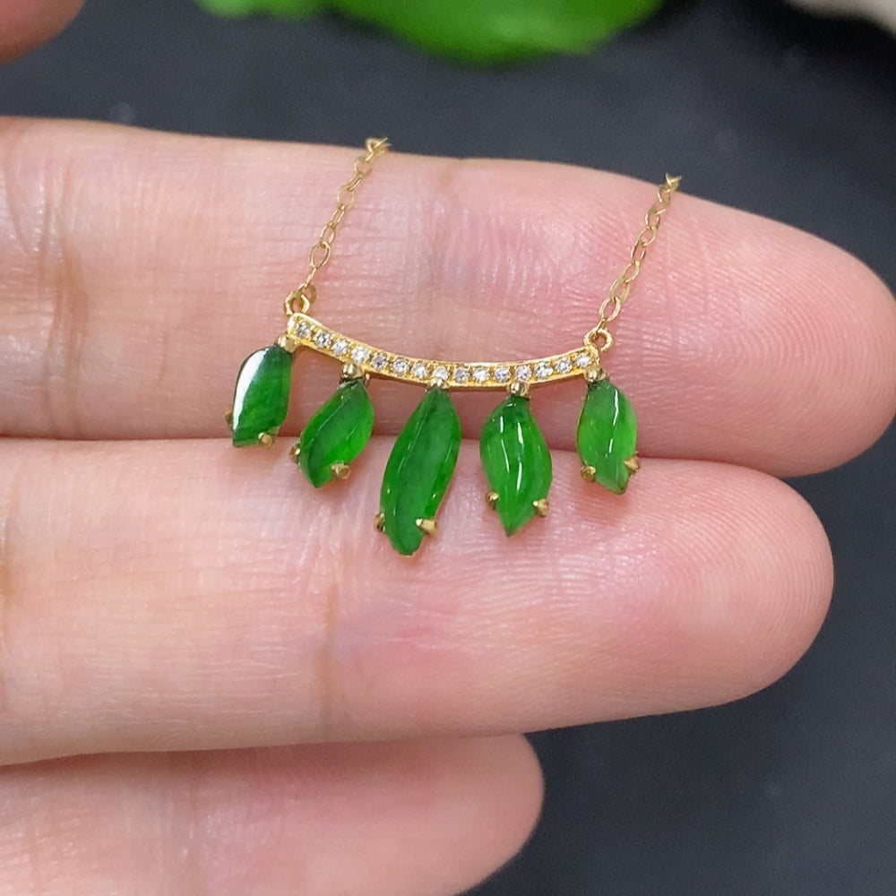 Jadeite inlaid pendant with diamond accents, 18K gold HKHQ jewelry, showcasing detailed craftsmanship and elegant design.
