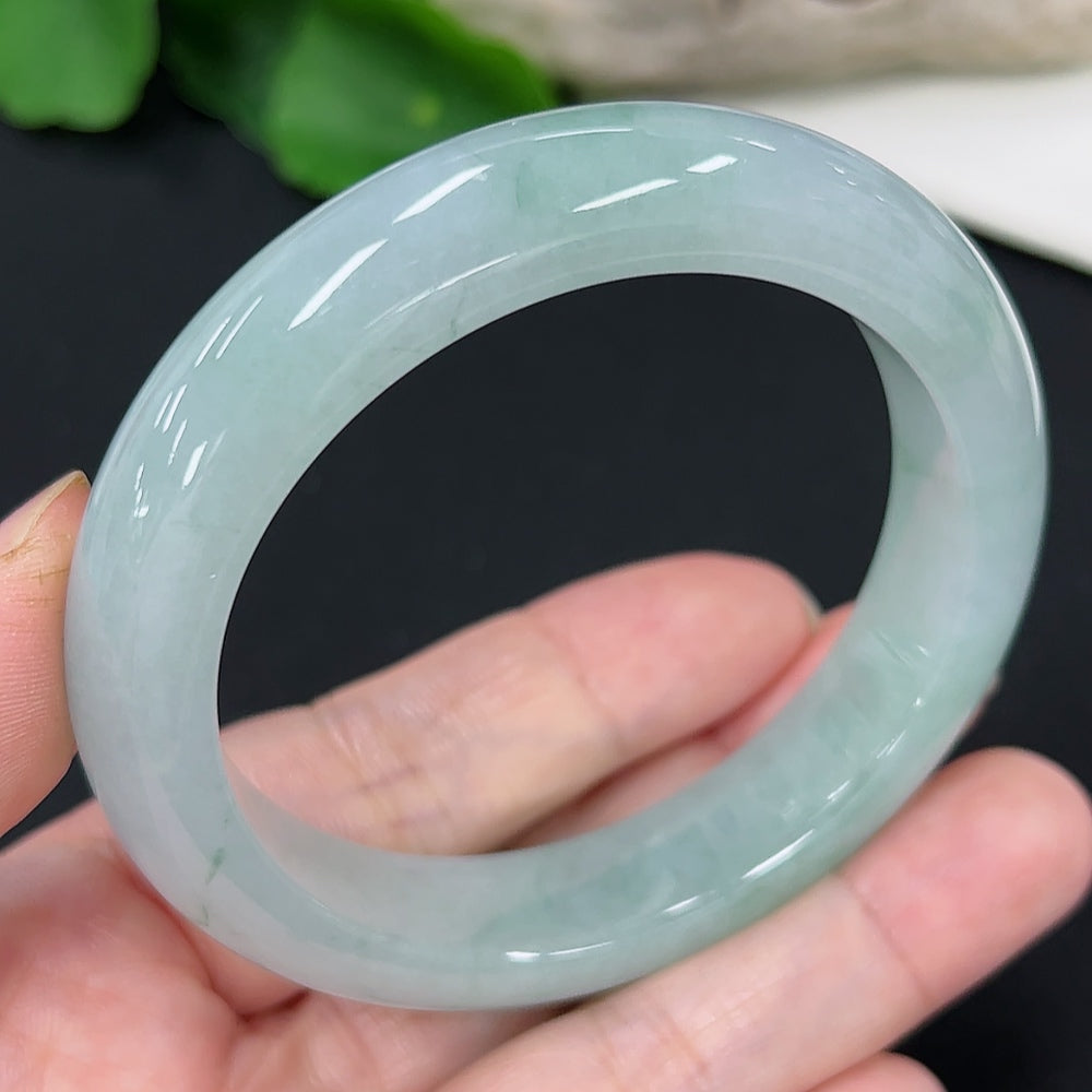 Jadeite round bangle with a size of 53.7, weighing approximately 56.5g, showcasing smooth, polished green jade from HKHQ.