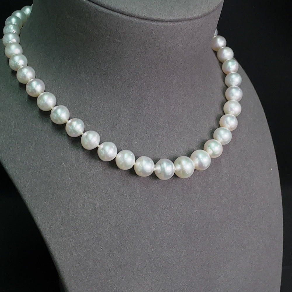 Saltwater pearl strand necklace with 14K gold clasp, featuring lustrous pearls and elegant design by HKHQ.