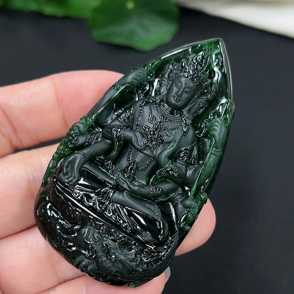 Jadeite Guanyin pendant necklace from HKHQ, featuring a detailed carved figure, weighs approximately 54.3 grams.