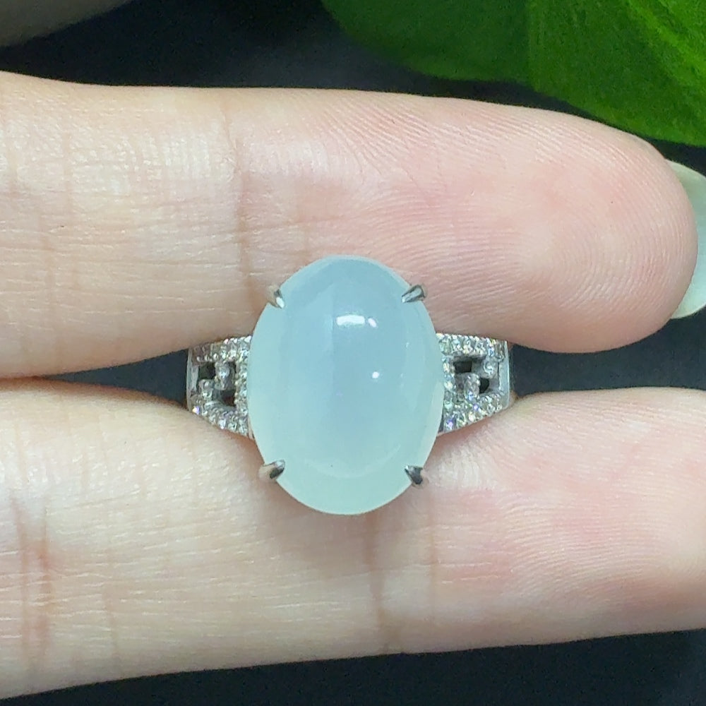 HKHQ jadeite and diamond 18k cabochon ring, size 14, with a polished jadeite gemstone and sparkling diamonds, weighing approx. 5.36g