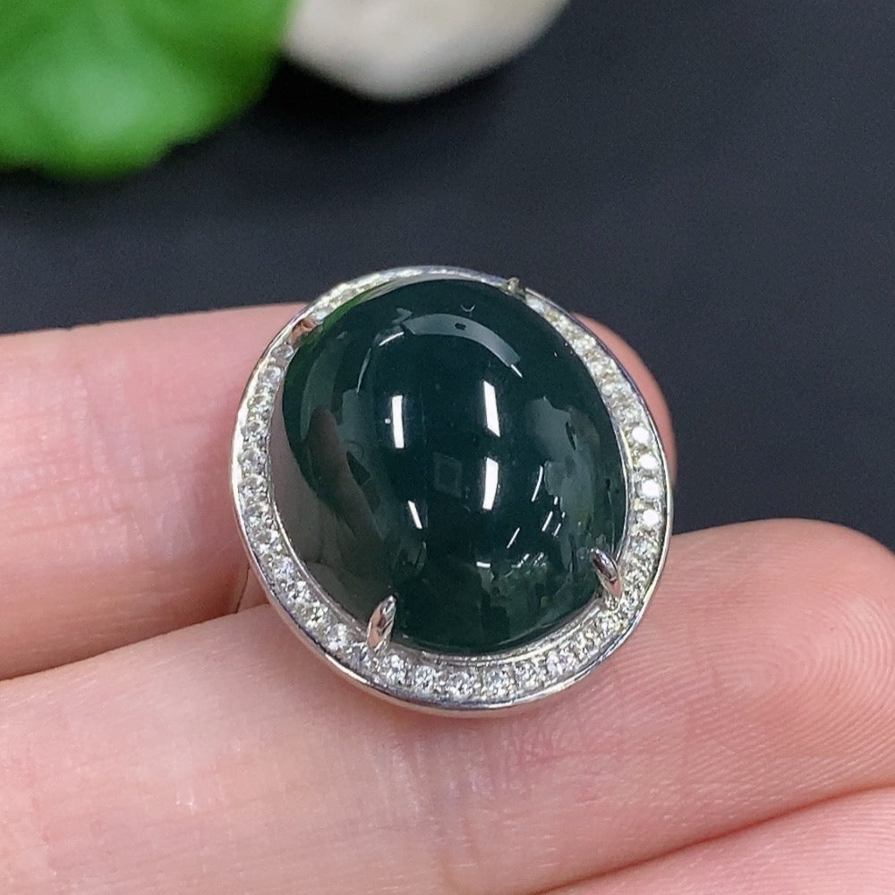 Jadeite cabochon ring with diamond accents in 18k gold, size 14, showcasing a polished green jade centerpiece and gold band.