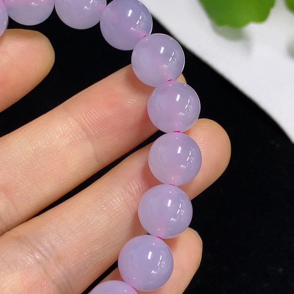 Jadeite bracelet with 9.8mm jade stones from HKHQ, non-gold, weighing approximately 30.64 grams, shown on a neutral background.