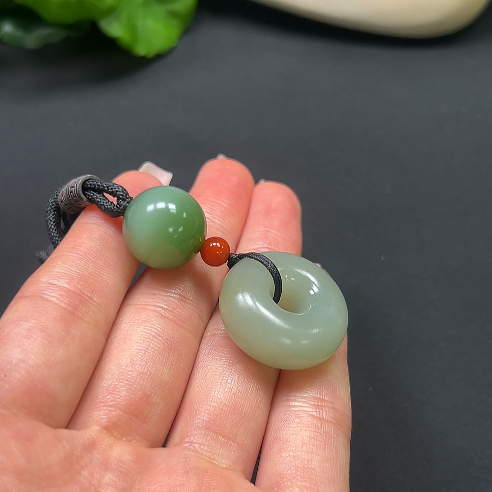 Hetian Jade Peace Knot pendant with Southern Red, HKHQ brand, featuring a 22.9g jade pendant on a rope.