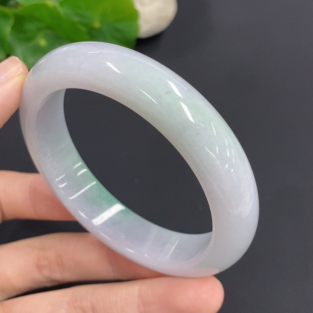 Jadeite round bangle with a 61.2g weight and size 57, featuring smooth, polished green jade from HKHQ.