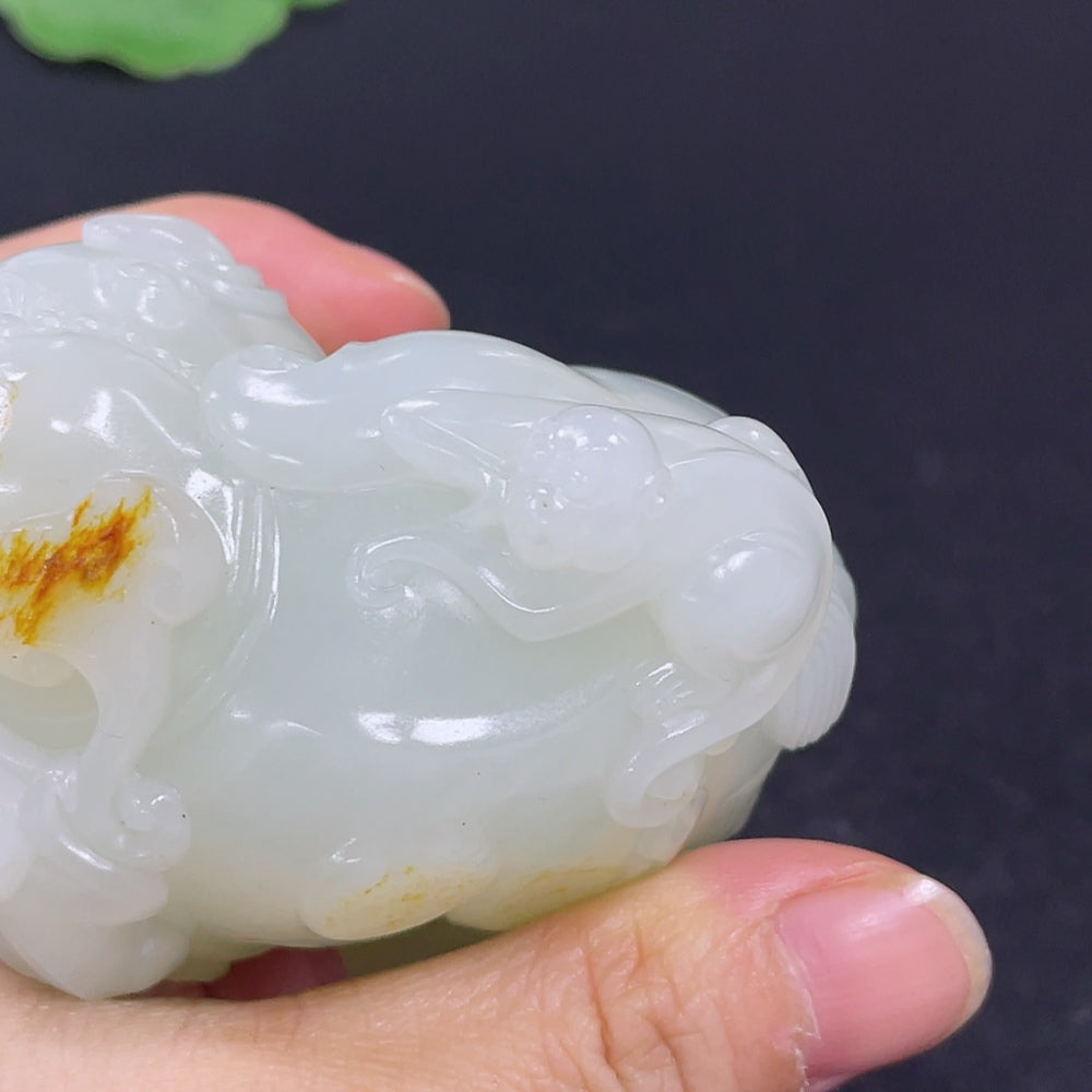 HKHQ Hetian Jade handheld carving depicting symbols of high rank and position, showcasing intricate craftsmanship and smooth jade surface.
