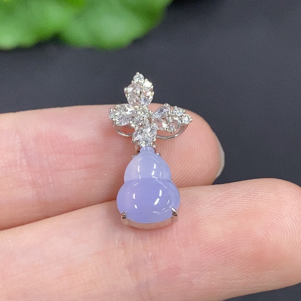 Jadeite gourd pendant with 18k gold and diamond accents, featuring intricate inlaid jade design and delicate craftsmanship.