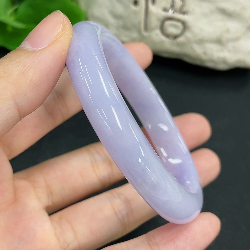 Jadeite Concubine Bracelet by HKHQ featuring smooth, polished jadeite beads and intricate traditional design.
