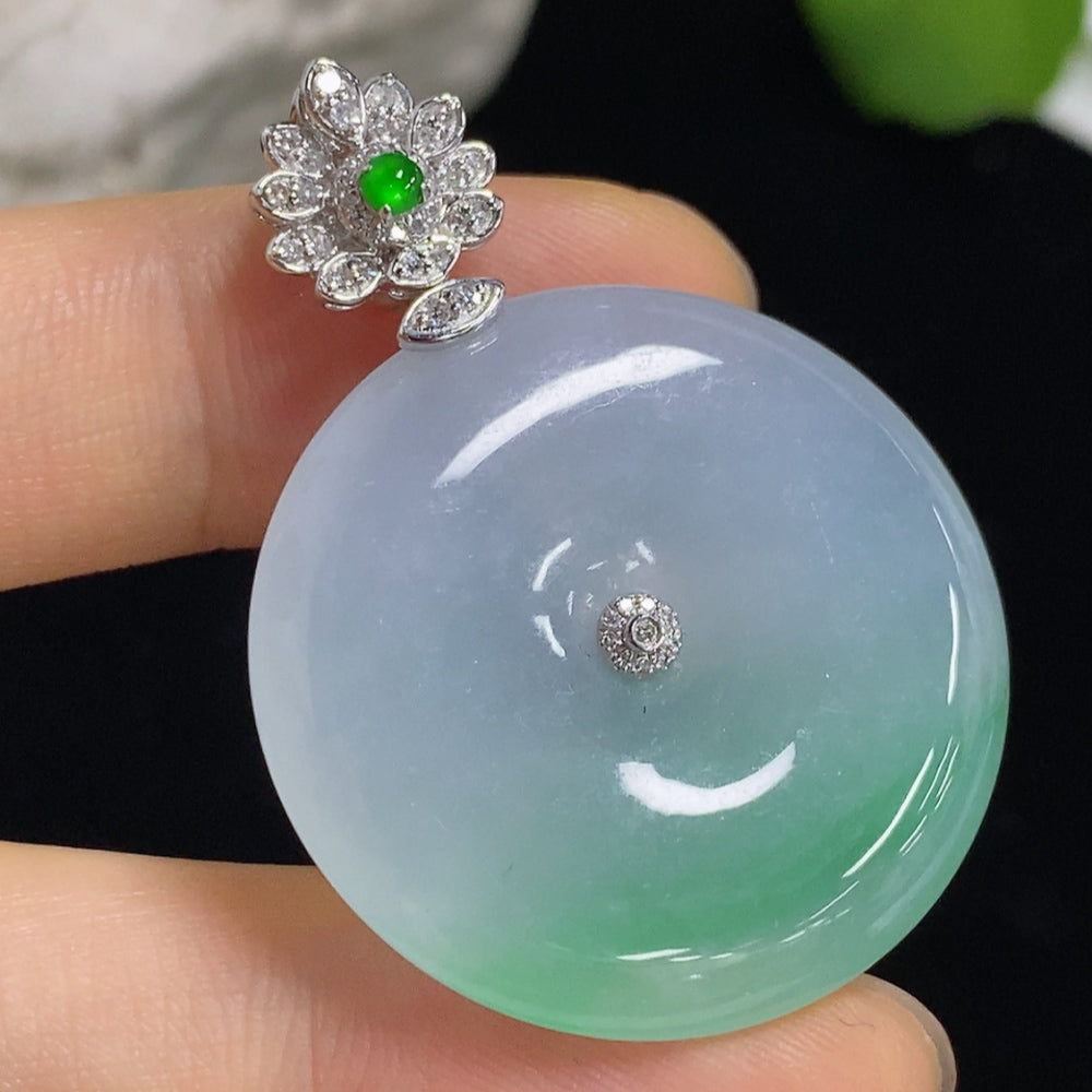 Jadeite pendant with peace buckle design, 18k gold and diamond accents, crafted by HKHQ, weighs approximately 11.6 grams.