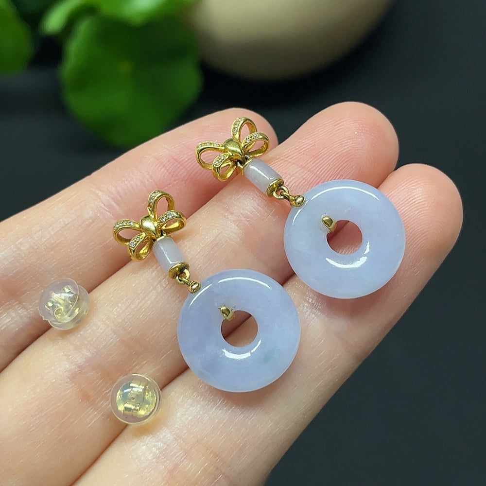 Jadeite donut earrings with 18K gold and diamond accents, showcasing smooth jade hoops with sparkling details.