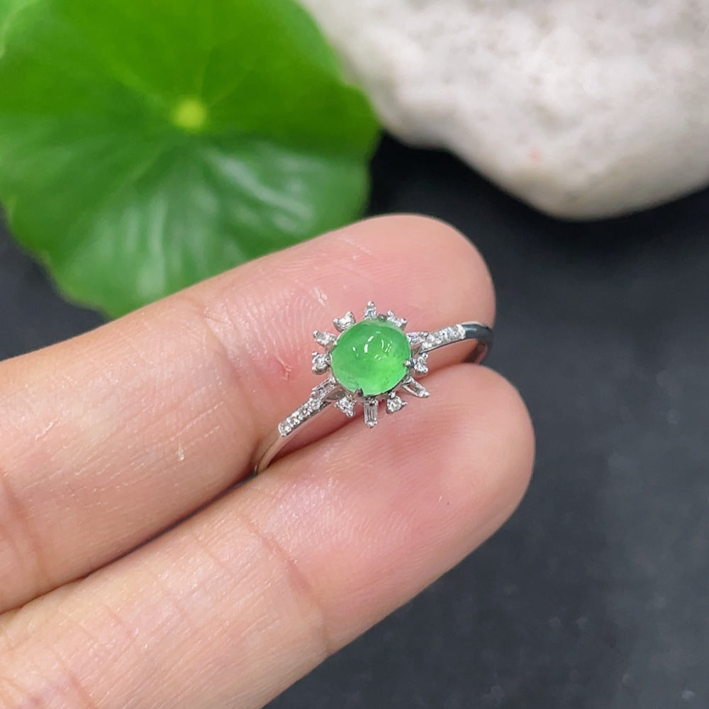 Jadeite cabochon ring with 18K gold setting and diamond accents, size 14, featuring a smooth green jade stone and elegant design.