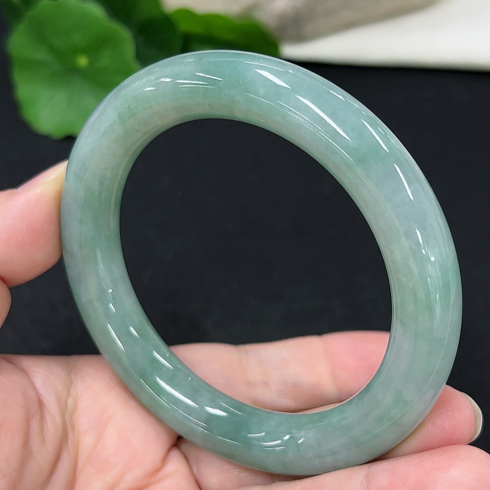 HKHQ jadeite round bangle, size 57.7, 68.6g, showcasing smooth, polished jadeite with a circular bracelet design.