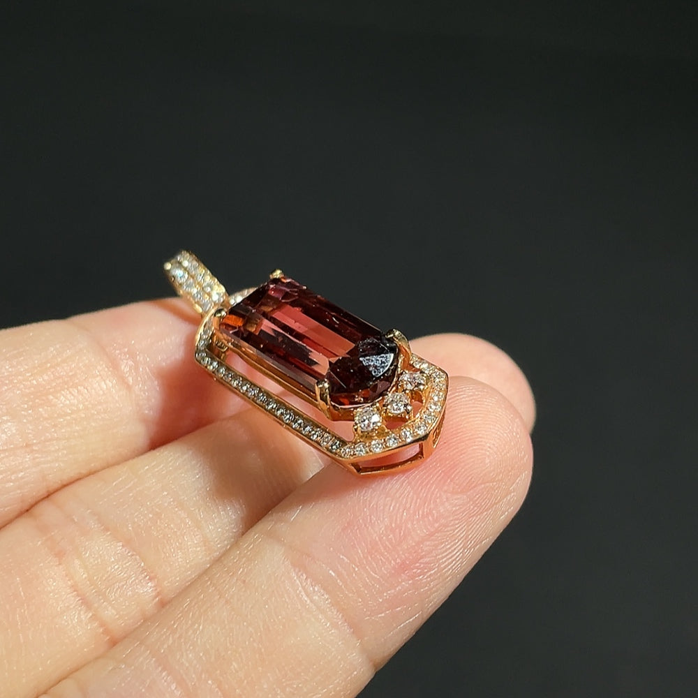 Tourmaline pendant with 18K gold and diamond accents, crafted by HKHQ, featuring a vibrant gemstone centerpiece and elegant design