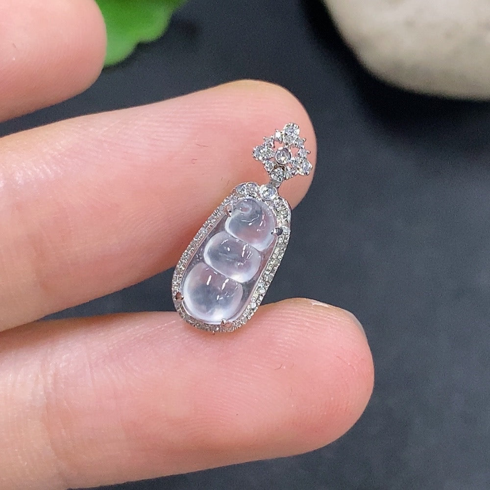 Jadeite auspicious bean pendant set in 18K gold with diamond accents, featuring a delicate jade jade pendant and matching jewelry.