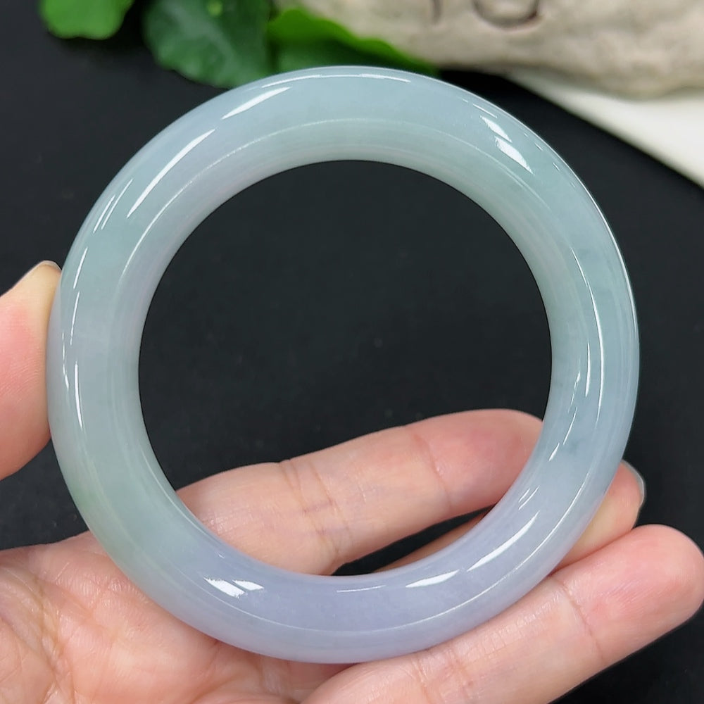 HKHQ jadeite round bangle, size 55.2, weighing 73.56g, showcasing smooth, polished jadeite bracelet on a neutral background.