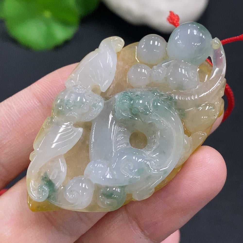 Jadeite pendant with cord, total weight approximately 25.2g (color origin undetermined)