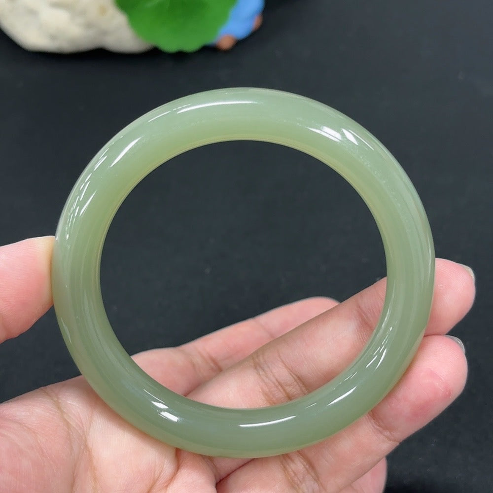 HKHQ Hetian Jade round bangle, size 56.9, weighs approx. 49.3g, showcasing smooth, polished green jade craftsmanship.