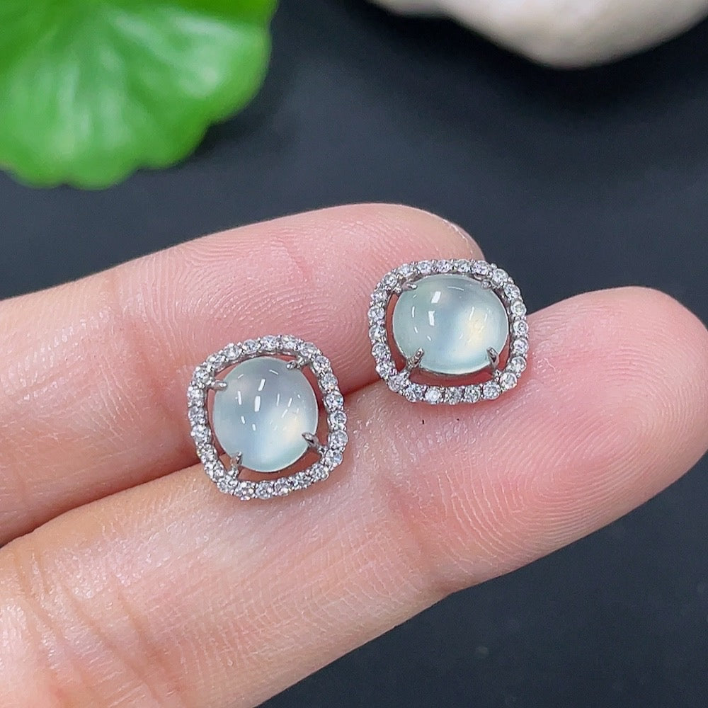 HKHQ jadeite earrings set in 18k gold with diamond accents, showcasing elegant green jade stones and sparkling diamond details.