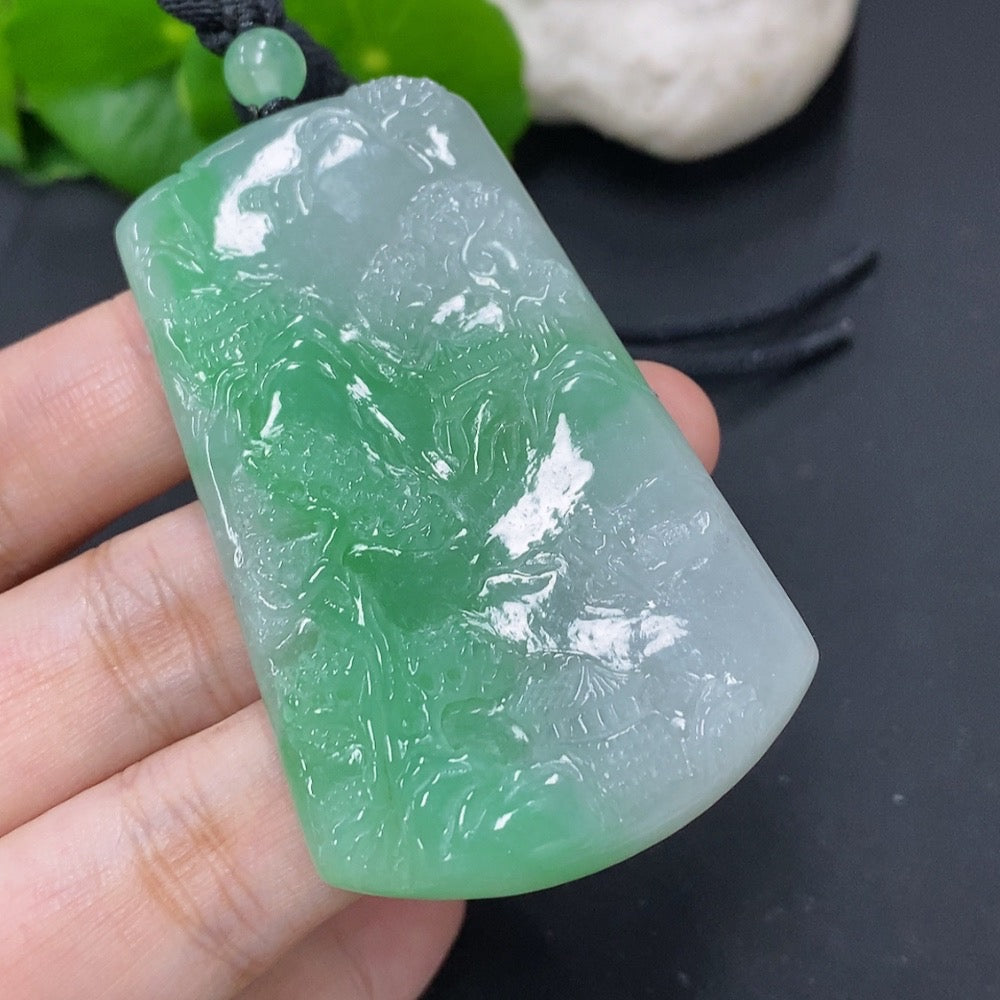 Jadeite pendant with landscape plaque and cord, weighing approximately 36.4g, crafted by HKHQ with intricate jade design.