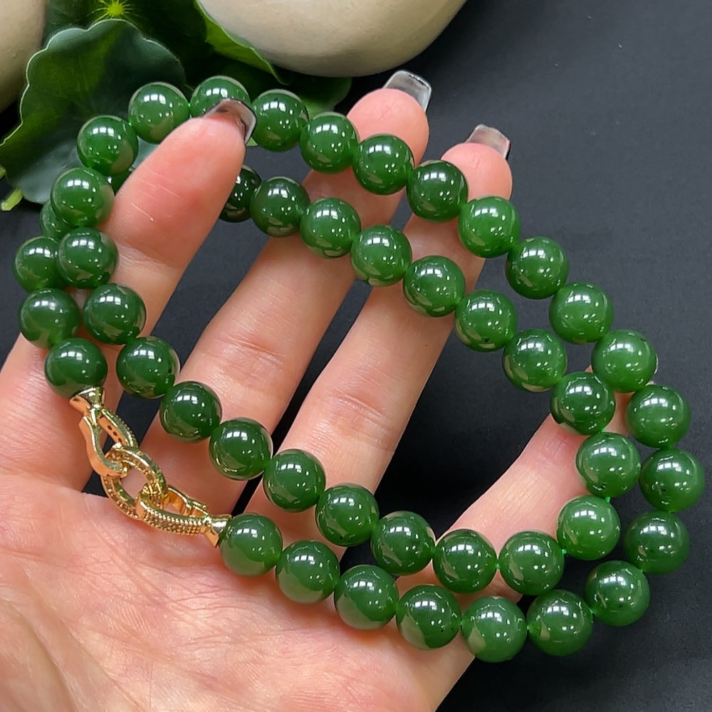 Hetian Jade bead necklace by HKHQ with 9.6mm beads, showcasing smooth, polished jade stones in a graceful strand.