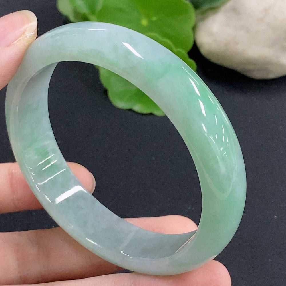 Jadeite round bangle by HKHQ, 51.9g weight, size 57, featuring smooth, polished jadeite surface on a reflective background.