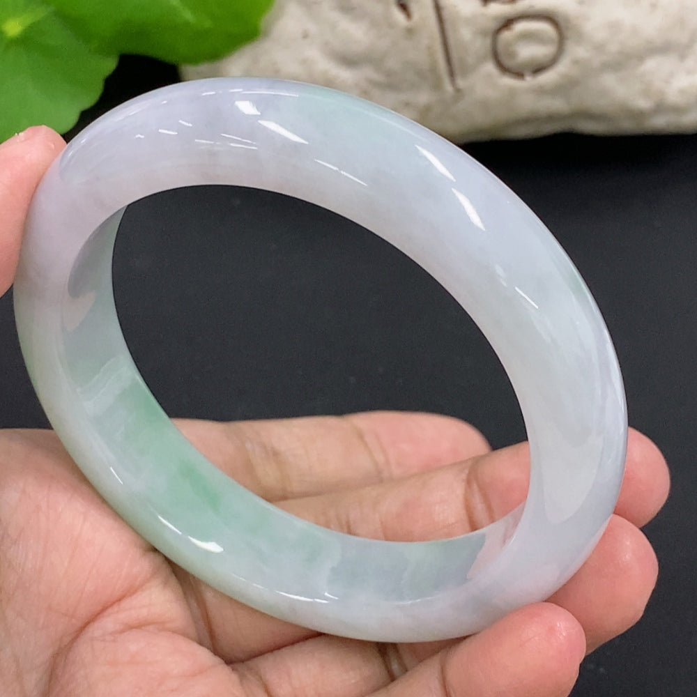 HKHQ jadeite round bangle with size 57.1 and weight 64.6g, showcasing smooth, polished jadeite surface and elegant circular design.