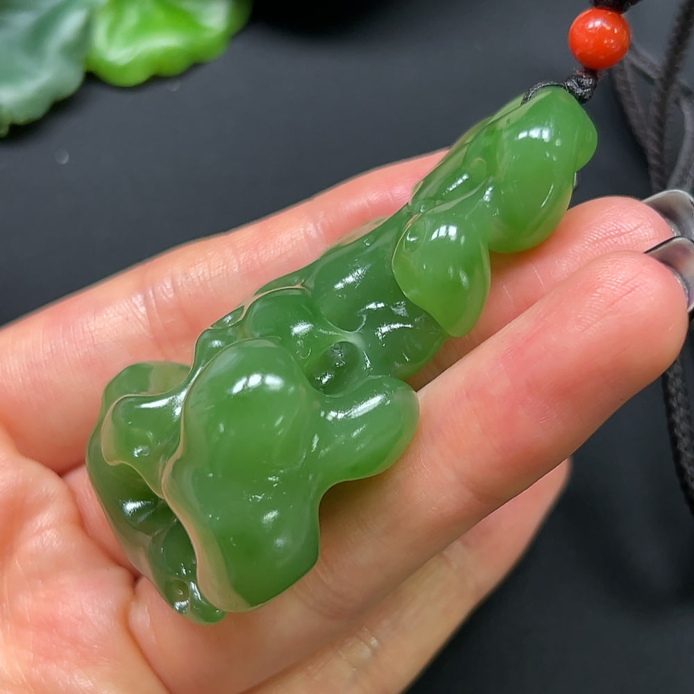 HKHQ Hetian Jade and coral stone pendant necklace with rope, weighing approximately 48.17g, featuring a detailed, elegant design.