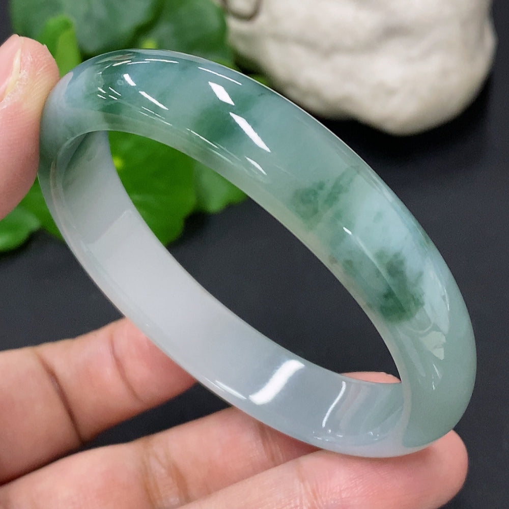 HKHQ jadeite concubine bracelet with size 55.3/47.6, weighing approximately 38.1g, featuring smooth, polished jade stones.