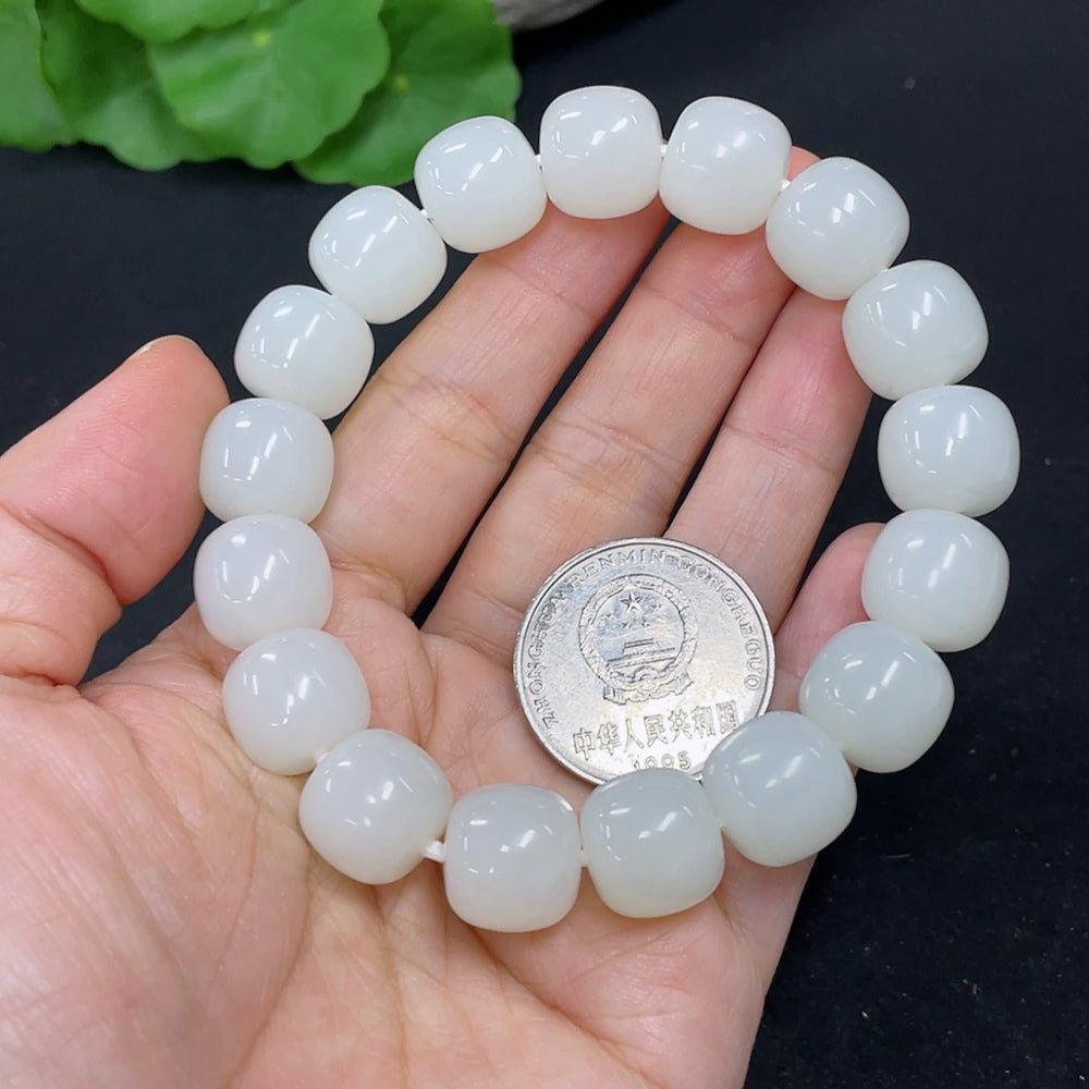 Hetian jade bracelet by HKHQ, showcasing smooth green jade beads, 60.5g, elegant bracelet design on a neutral background.