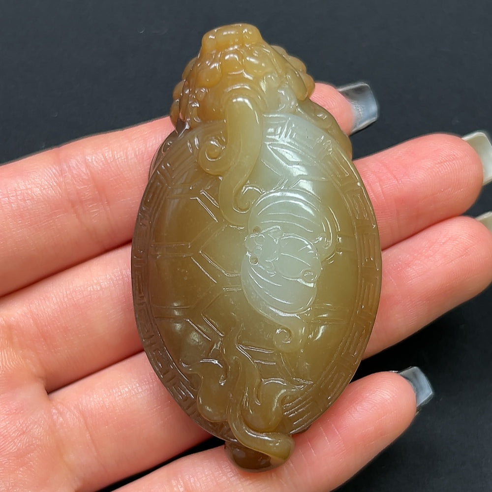 Hetian jade dragon turtle pendant with detailed carving, weighs approximately 54g, crafted by HKHQ.
