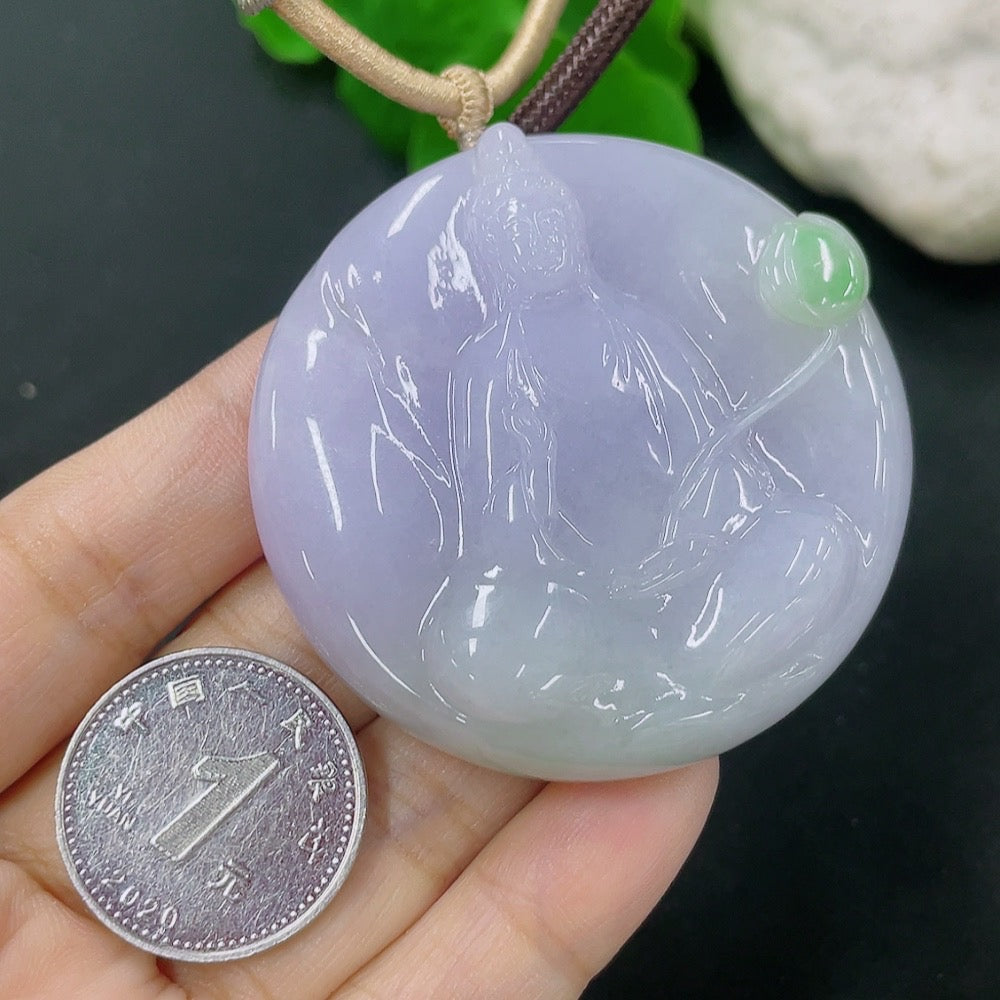 Jadeite Guanyin pendant weighing approximately 60.68g with rope, crafted from green jade, showcasing detailed religious figure design.