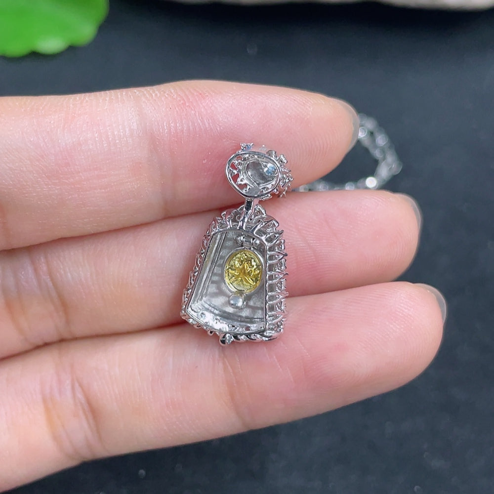 Jadeite pendant with 18K gold accents and diamond details, featuring a smooth jade stone and a delicate chain.