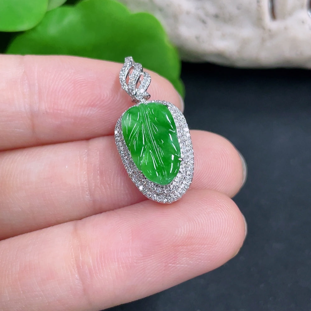 Jadeite leaf pendant with 18k gold accents and diamond details, showcasing intricate craftsmanship and natural green jade color.