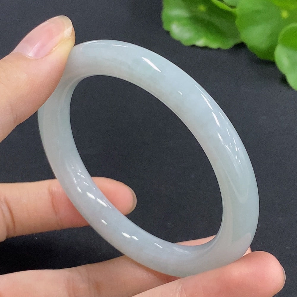 Jadeite round bangle in size 52, crafted from jade, with a total weight of approximately 35.12 grams, showcasing smooth, polished surface.