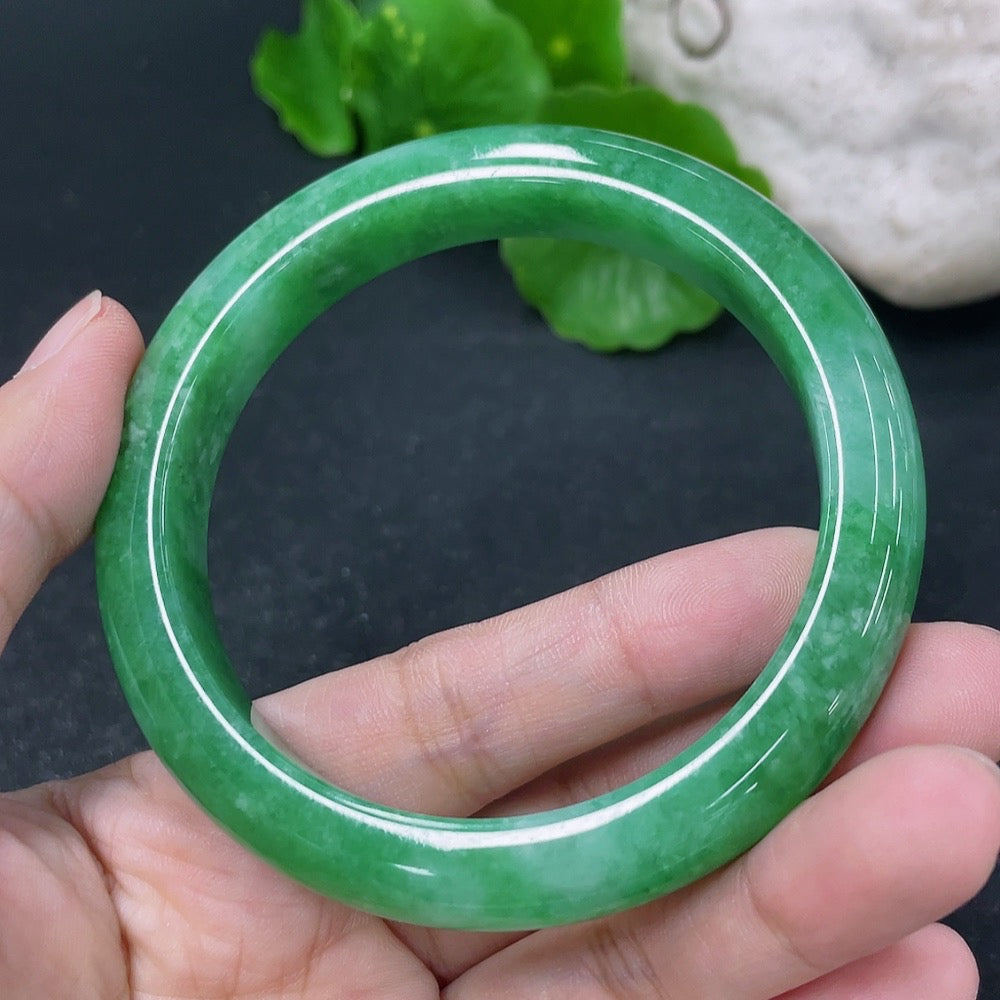 Jadeite round bangle in size 56.5mm with a total weight of 56.9g, showcasing smooth, polished jadeite from HKHQ.