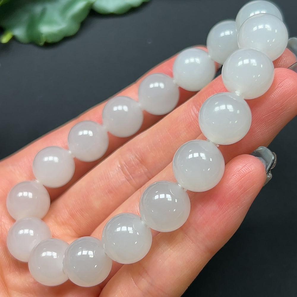 HKHQ Hetian Jade bracelet with 11.9mm beads, approximately 44.52g, showcasing smooth, polished jade stones on a stylish bracelet.