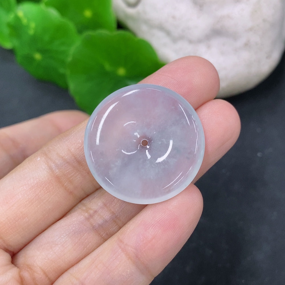 Jadeite pendant featuring a peace knot design, weighing approximately 6.72g, crafted by HKHQ, with a smooth, polished surface.