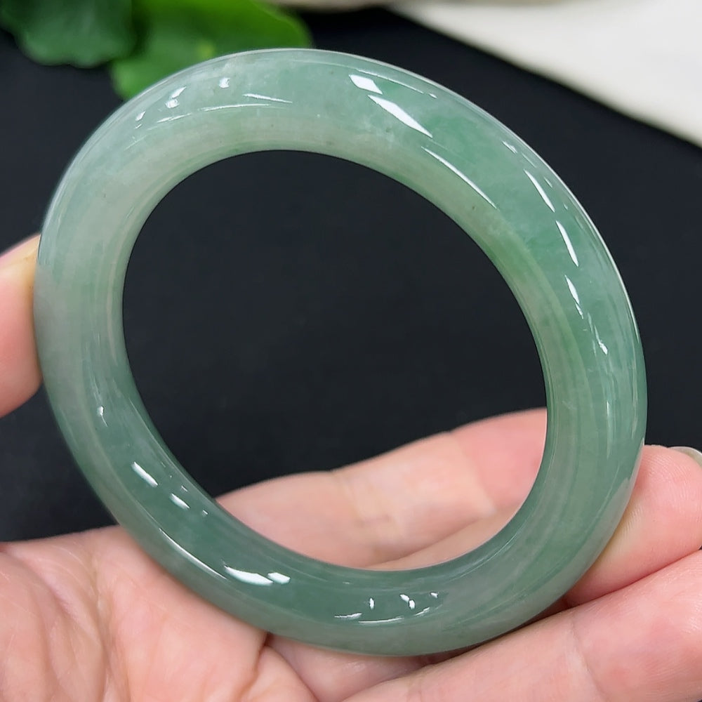 HKHQ jadeite round bangle, size 54.3, with a smooth glossy surface and a total weight of 58.4 grams, displayed on a neutral background.