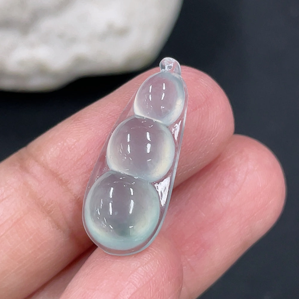 Jadeite auspicious bean inlay piece with detailed carvings, weighing approximately 1.88g, from HKHQ.