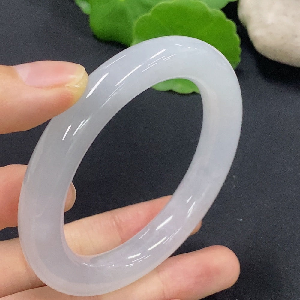 Jadeite round bangle in size 50.2 with approximately 50.18g weight, showcasing smooth green jade with polished finish.