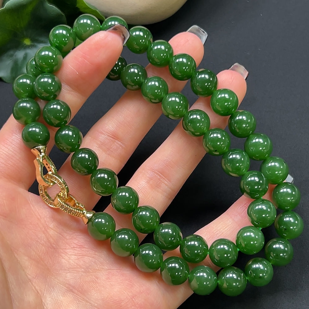 Hetian jade bead necklace by HKHQ with 9.6mm beads, non-gold, approximately 68.36g, natural green jade stones on a string.