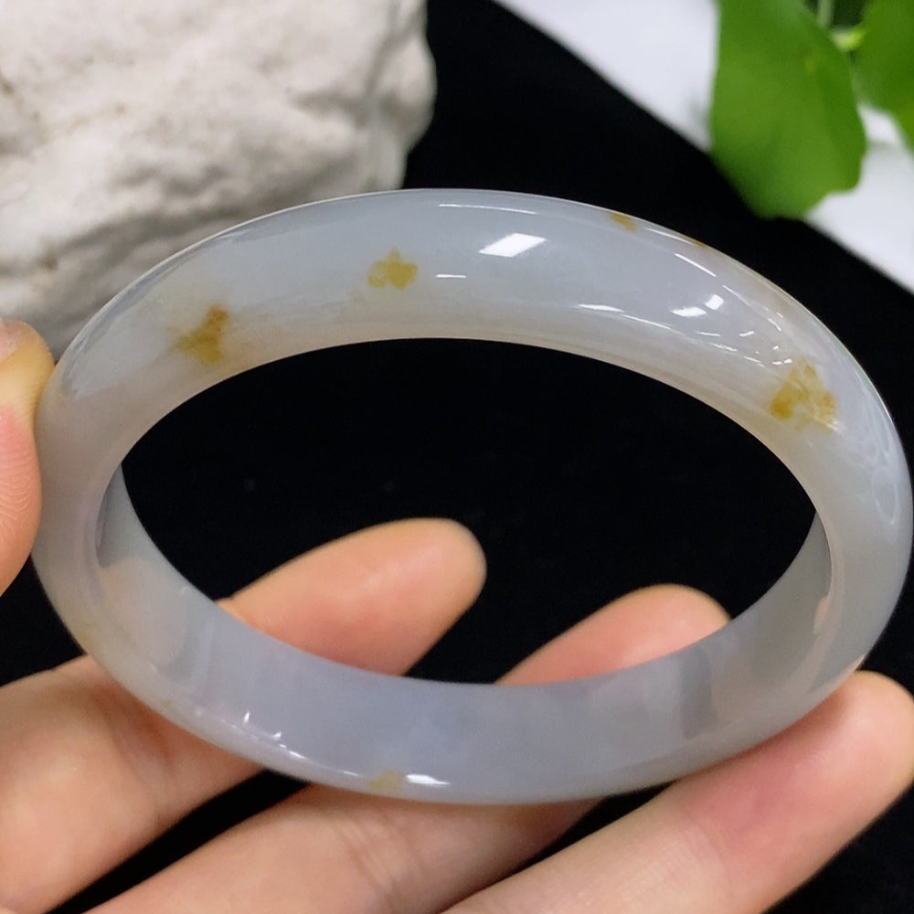 HKHQ jadeite round bangle with a 46.7g weight and size 59.5, showcasing smooth, polished green jade surface.