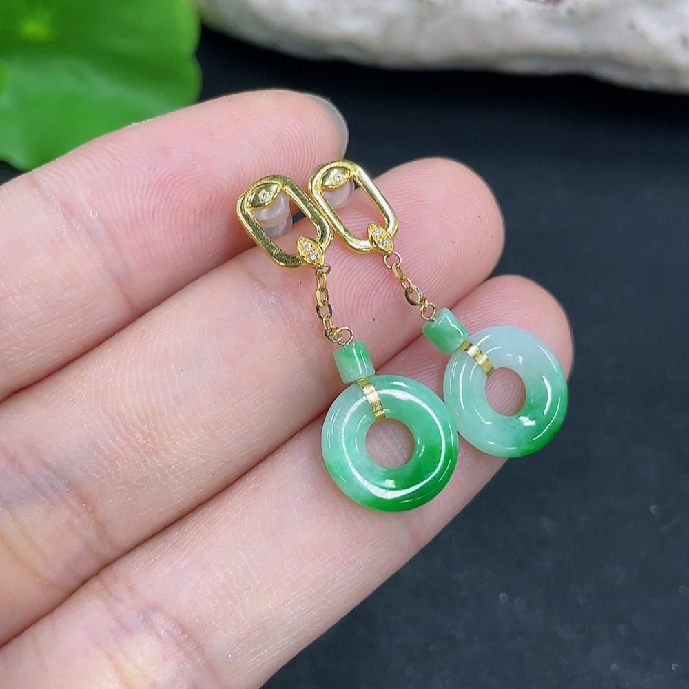HKHQ jadeite earrings with 18k gold setting, lightweight and elegant, showcasing smooth jade gemstones on a neutral background.