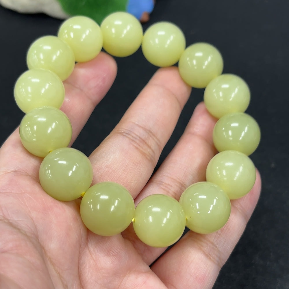 HKHQ Hetian Jade bracelet with 15.9mm beads, featuring smooth, polished jade stones in a durable, elegant design.