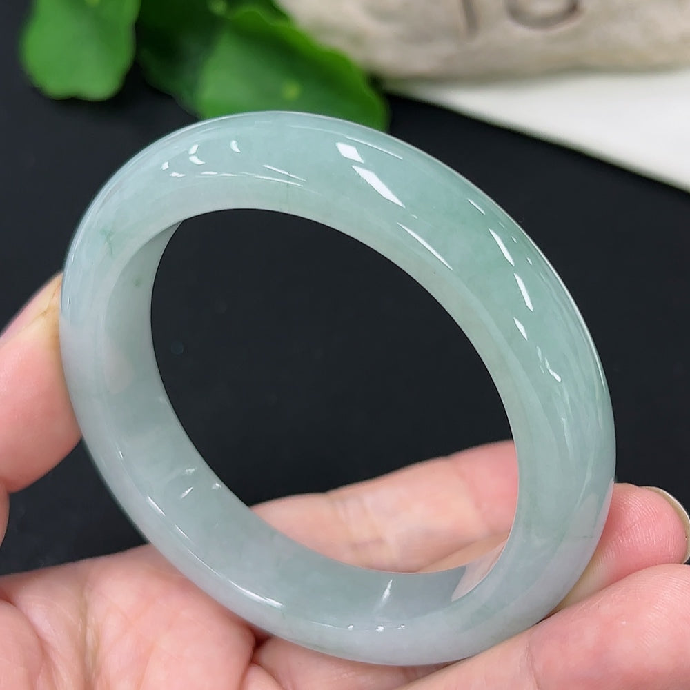 Jadeite round bangle in size 53.7 with a total weight of 56.5g, featuring smooth, polished jadeite surface and vibrant green color.