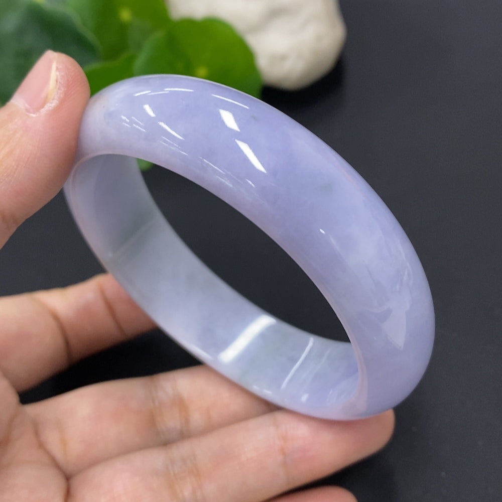 Jadeite round bangle with a smooth finish, size 60.2, weighing approximately 71.3g, from HKHQ.