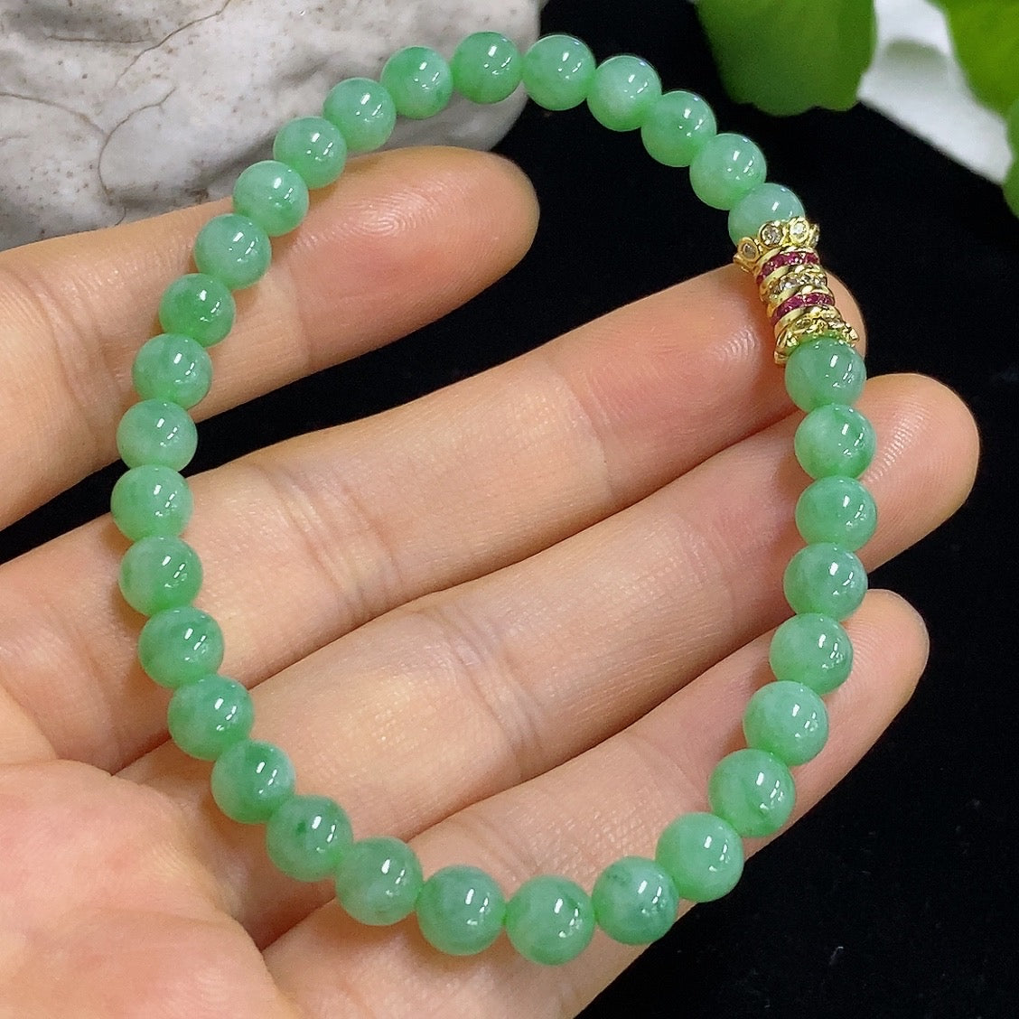 Jadeite bracelet with 5.6mm jade beads, non-gold, weighing approximately 11.96g, featuring smooth, polished jade stones.