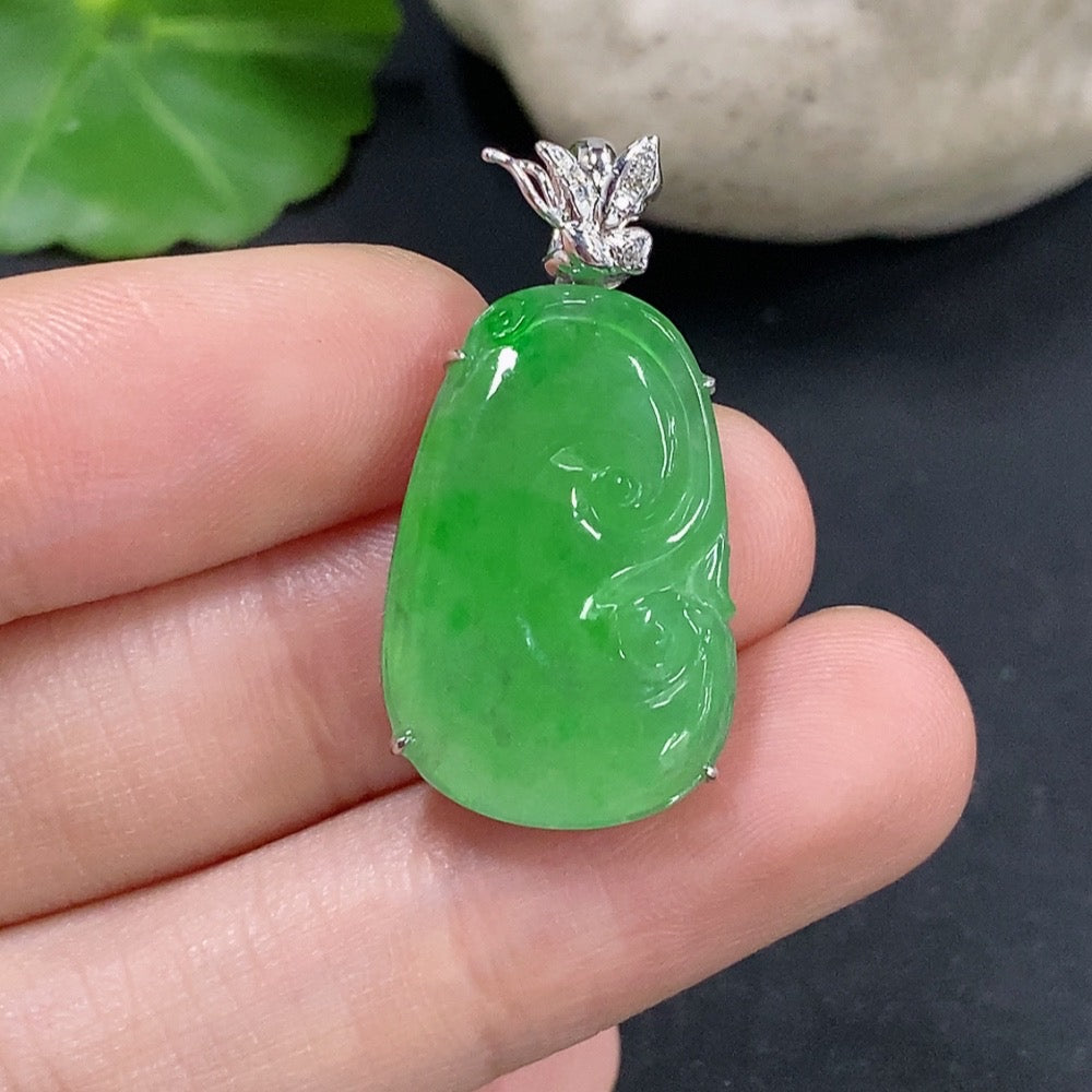 Jadeite Ruyi pendant with 18K gold and diamonds, showcasing intricate craftsmanship and a smooth jade surface.