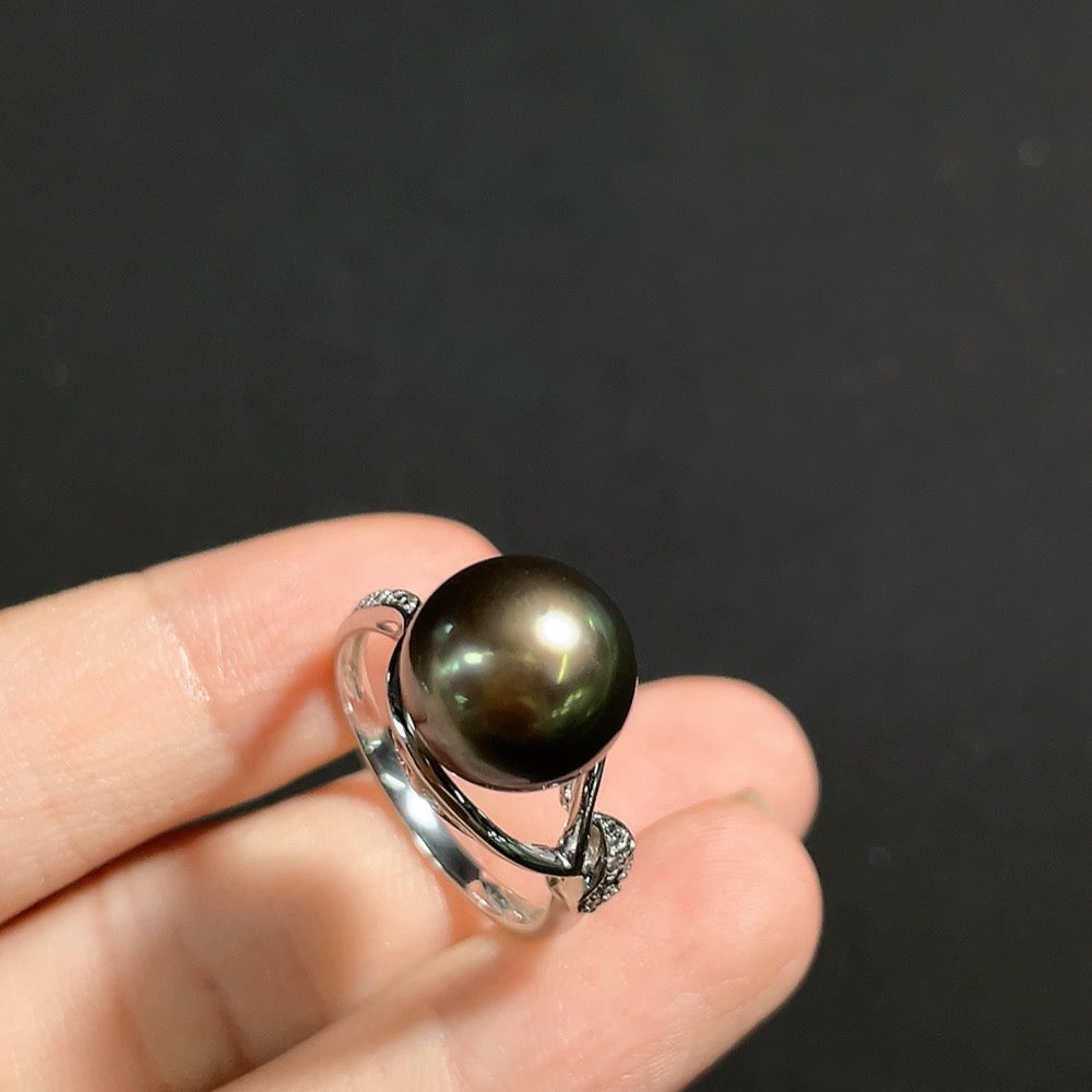 Seawater pearl ring with diamond accents in 18k gold, size 16, featuring a 10.8mm pearl and delicate detailing.