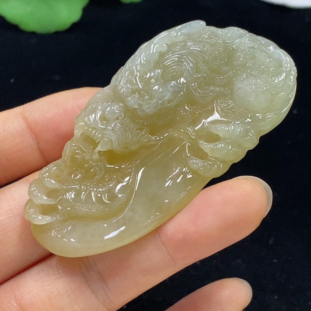 Jadeite dragon pendant from HKHQ, detailed jade jewelry piece weighing approximately 34.71g, showcasing intricate craftsmanship.
